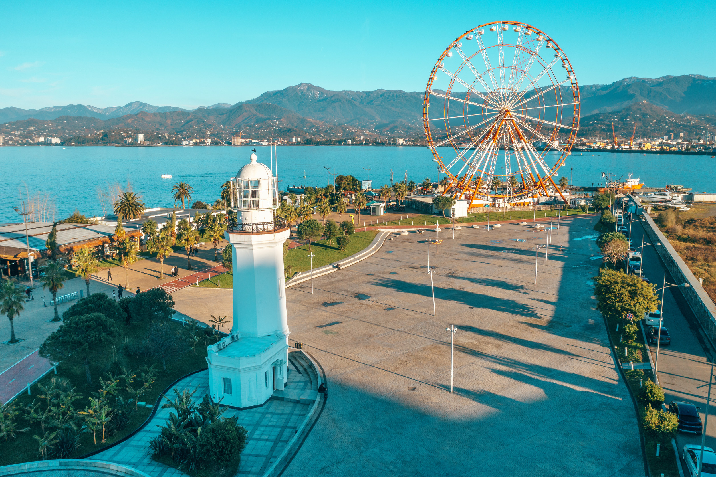 aerial drone view of batumi embankment with lighthouse and ferris wheel famous georgian resort