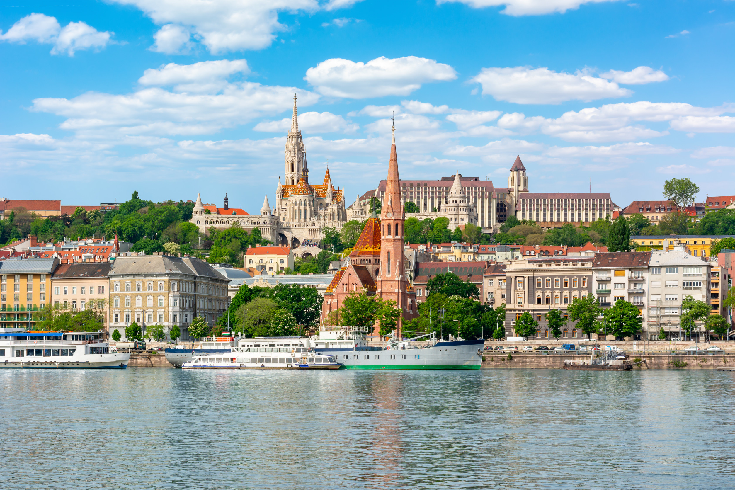 budapest hungary danube river bank with colorful houses and boats