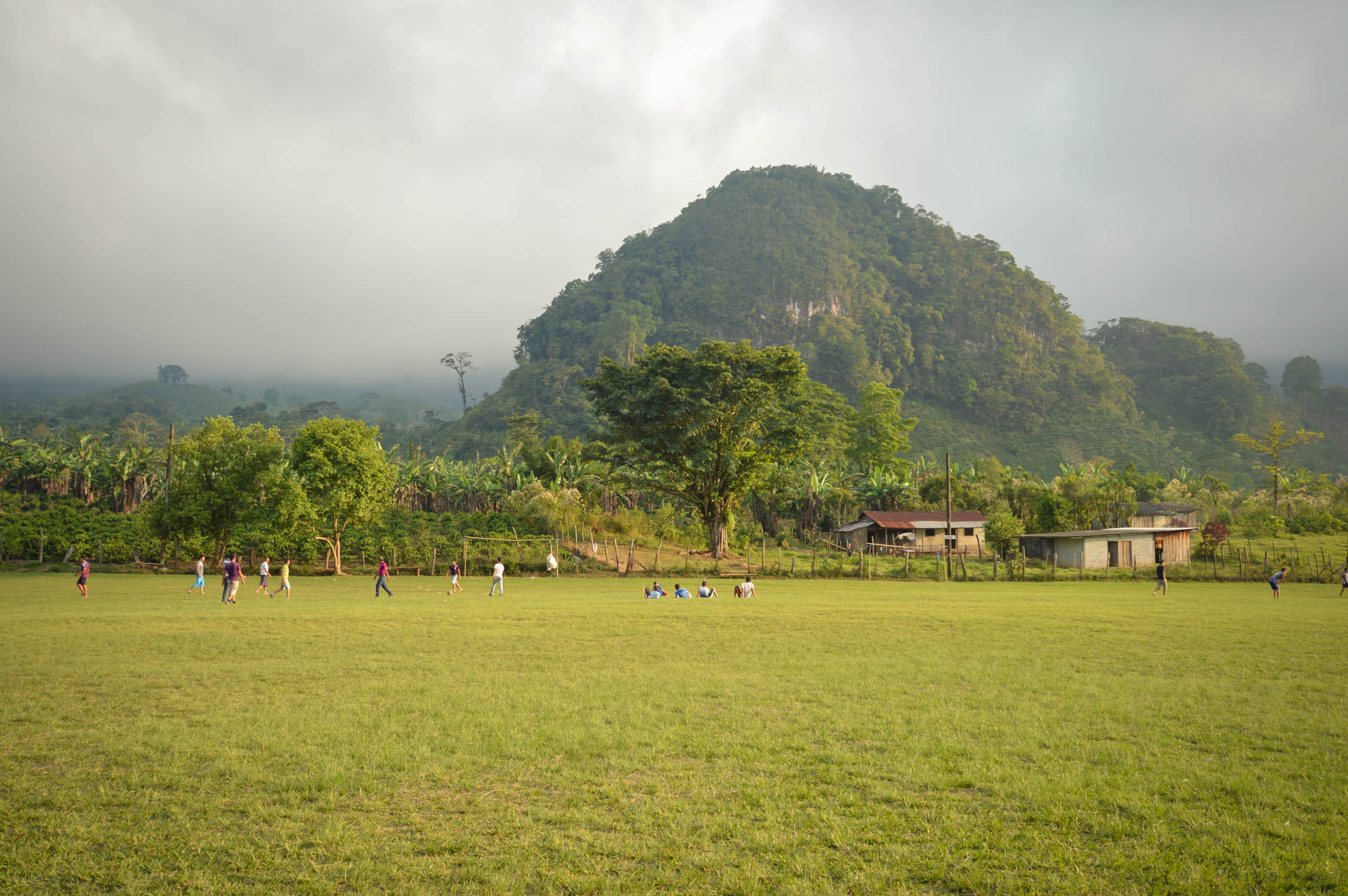 football field and the foggy mountainous landscapes of santa barbara national park in honduras