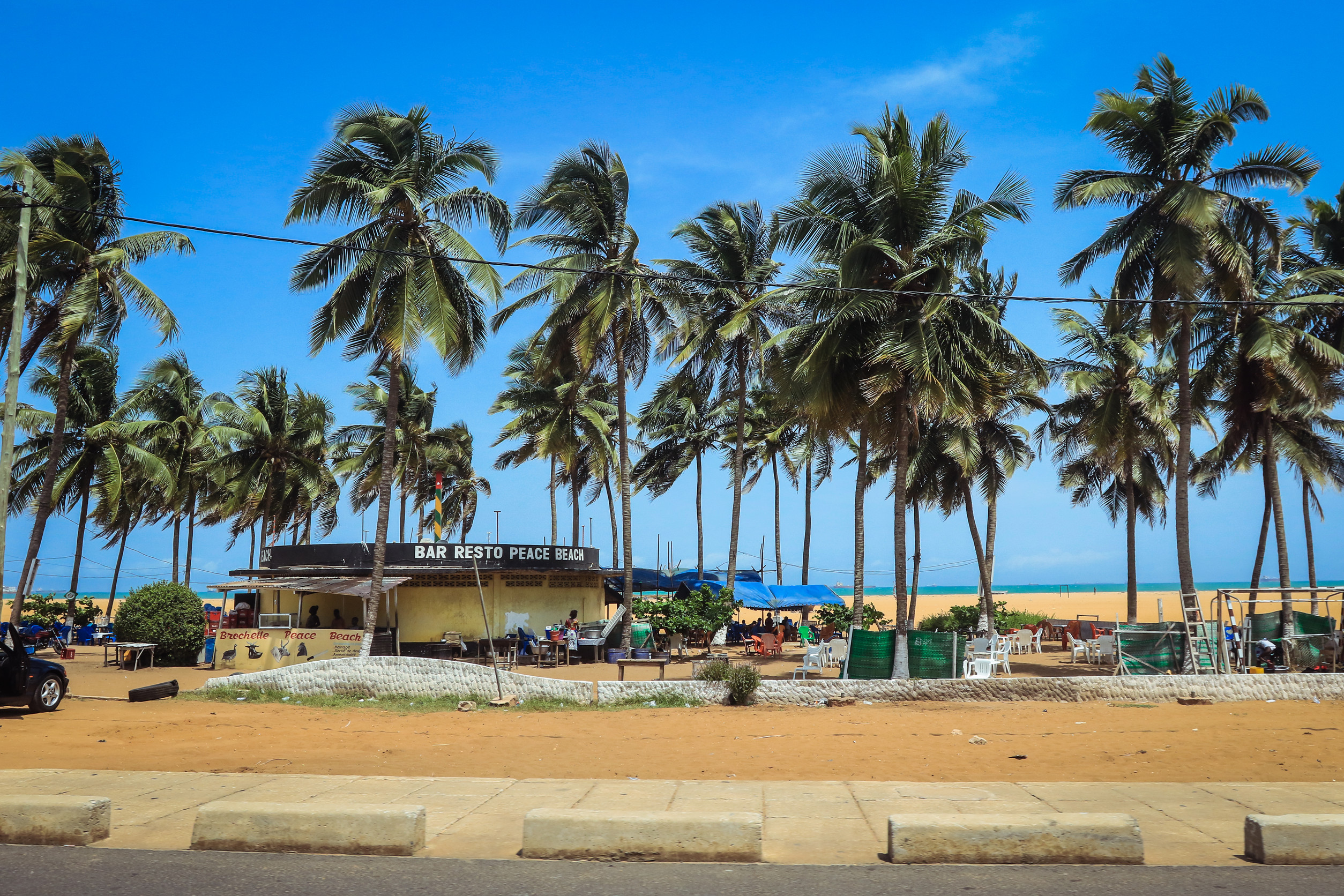 ocean seaside trees and sandy beach in togo west africa