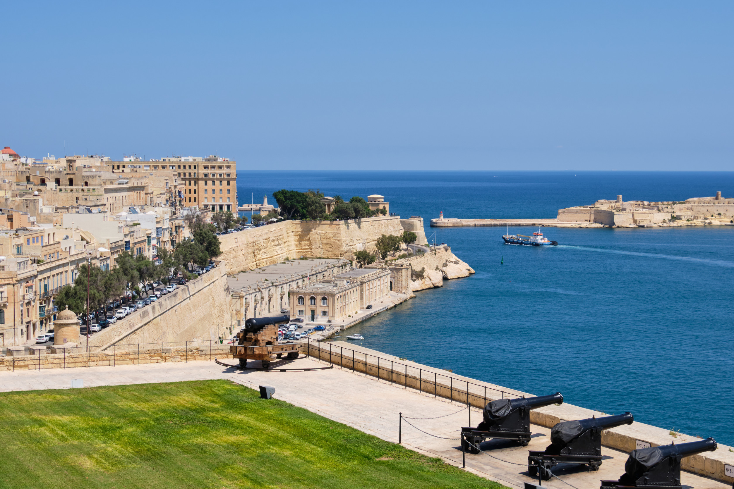 panoramic view of the grand harbour and the fortified walls from the upper barrakka gardens valletta