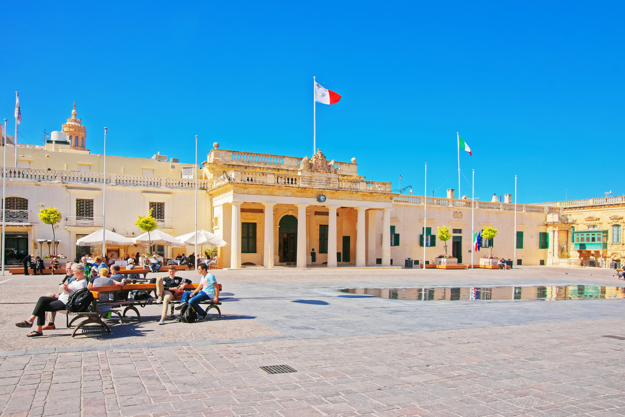 panoramic view of the grand harbour and the fortified walls from the upper barrakka gardens valletta